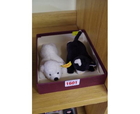 A Steiff polar bear and similar cat,&nbsp;each with magnetic paws.&nbsp; 