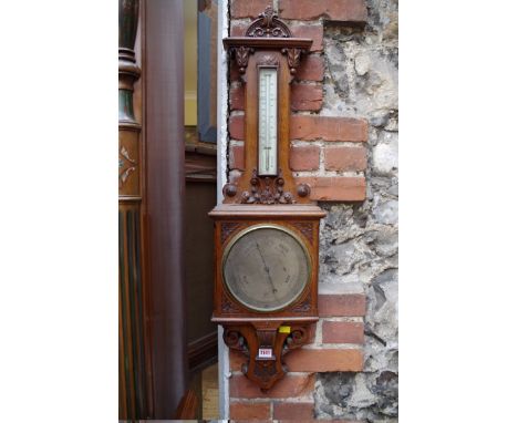 A late Victorian carved oak banjo barometer,&nbsp;the silvered dial inscribed 'Casella, maker to the Admiralty and Ordnance, 