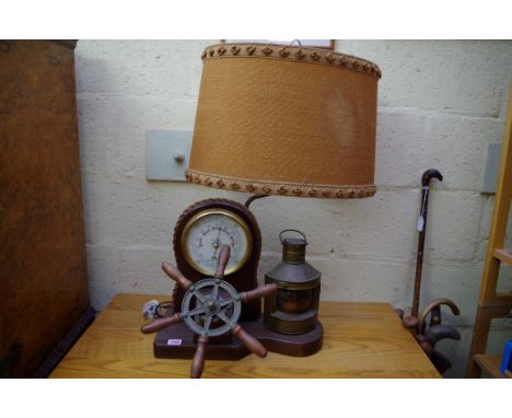 A 1960s oak novelty nautical combined barometer and table lamp,&nbsp;total height 75cm. 