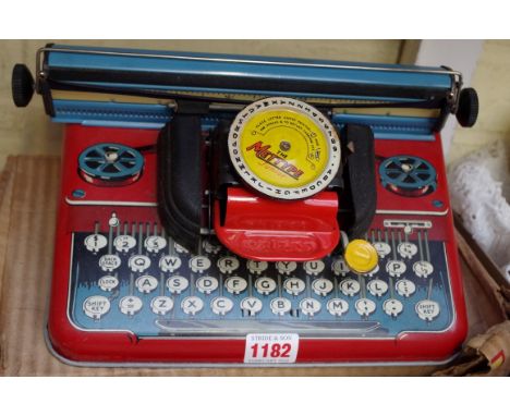 A vintage Mettype tinplate toy typewriter,&nbsp;in original box; together with a novelty Garfield telephone.&nbsp; 