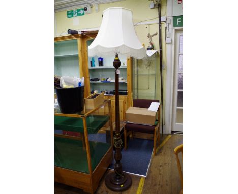 A mahogany standard lamp,&nbsp;with fluted column and circular base.&nbsp; 