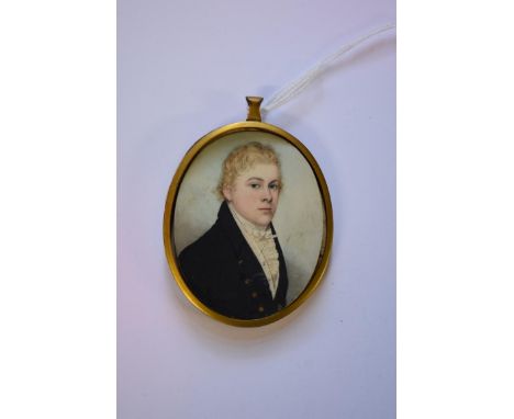 English School early 19th century,&nbsp;bust length portrait miniature of a gentleman in a navy blue jacket and with white cr