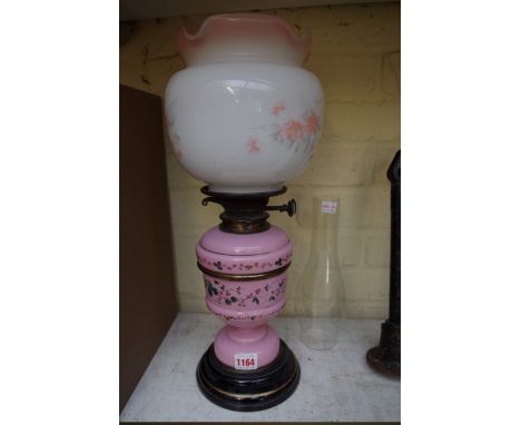 A Victorian pink glass oil lamp.&nbsp; 