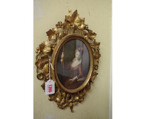 European School,&nbsp;18th/19th century, half length portrait of a lady holding an oyster shell, watercolour, 17.5 x 14cm ova