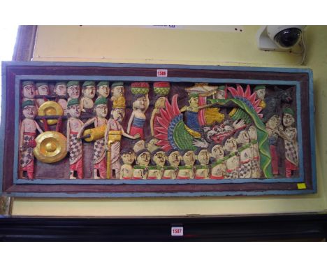 A South Seas carved and polychrome painted wood panel,&nbsp;40x 96.5cm. 