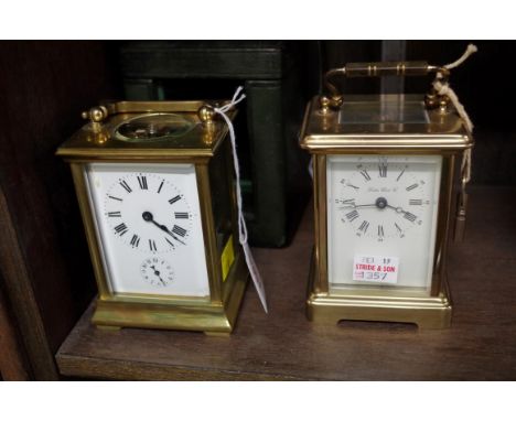 A brass carriage clock, with alarm and bell strike, height including handle 14.5cm, with green leather travel case; together 