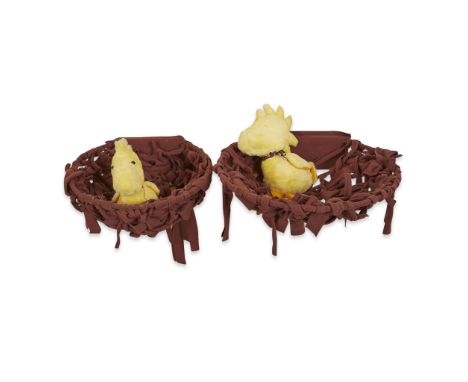 Two large plush and felt wall displays depicting Woodstock in his nest. One doll with a dotted yellow ribbon and the other wi