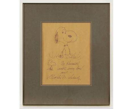 Charles Schulz (American, 1922-2000). Hand drawn ink on paper cartoon depicting Snoopy and Woodstock. Inscribed "To Kenneth w