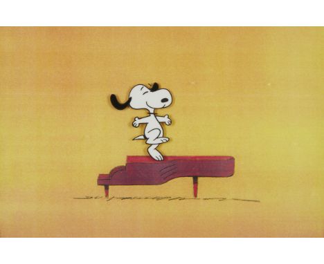 Original hand-painted Peanuts production animation cel depicting Snoopy dancing atop a piano, ca. 1970s. Created for a televi