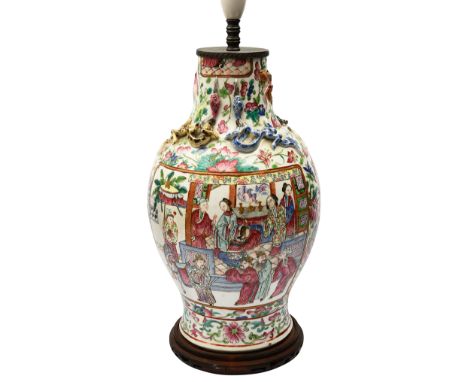 A late 19th Century Chinese Canton famille rose vase adapted as table lamp baluster form with applied chilong, decorated in e