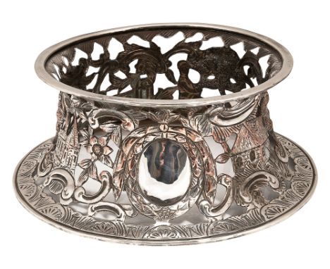 A George III Old Sheffield plate dish ringof waisted circular form,  pierced and embossed in the Irish Rococo style with a ce