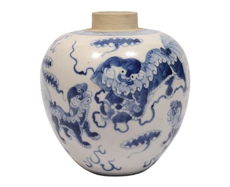 A small 19th century Chinese blue and white porcelain ginger jarovoid form, decorated with Buddhist lion dogs chasing a broca