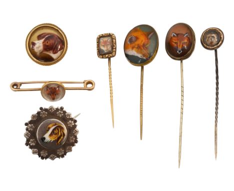 A group of stick pins and brooches of sporting interest including; an Essex crystal fox bar brooch with indistinct '18ct' mar