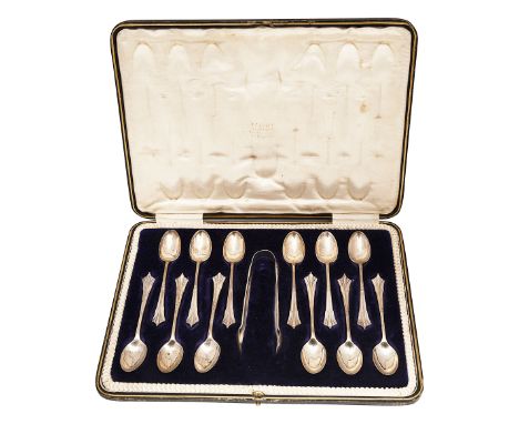 A cased set of twelve Edwardian silver Albany pattern coffee spoons and a pair Elizabeth II novelty silver horseshoe napkin h