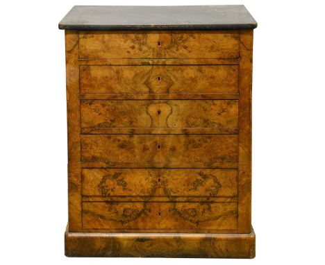 A Louis Philippe figured walnut commodethe ebonised top above four drawers and two dummy drawers enclosed by rounded corners,