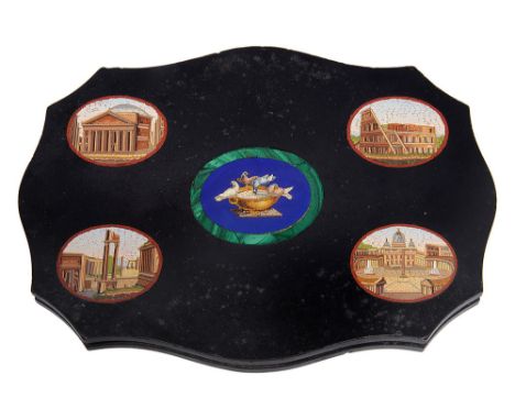 A 19th century Italian Grand Tour micromosaic paperweight the shaped black marble with central blue hardstone panel inlaid wi