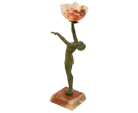 An Art Deco bronzed spelter and alabaster figural lampin the form of a standing young woman holding up an alabaster shade, on