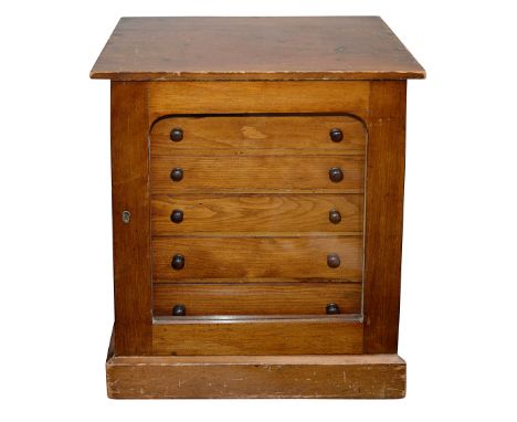 A late 19th century mahogany fronted pine tabletop collectors cabinetarched glazed door enclosing six graduated long drawers 