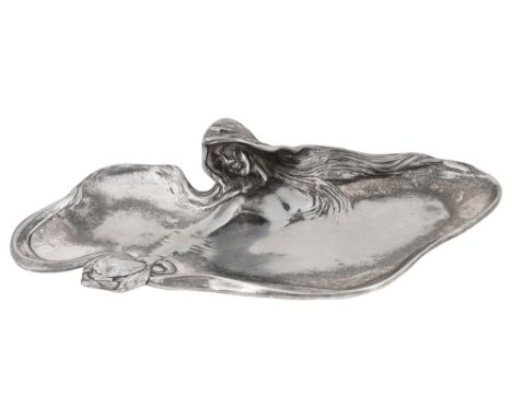 A continental Art Nouveau silver plated pewter figural card tray possibly WMF,of sinuous outline, modelled with a maidens bus