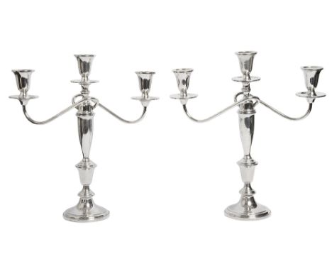 A pair of modern American silver three light candelabrastamped Towle Sterling,of plain screw fitting sectional design with tw