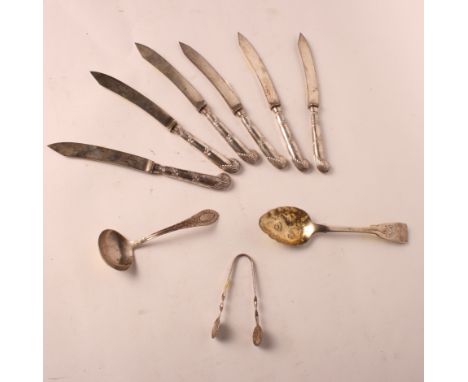 A Georgian Irish silver berry spoon, a set of six dessert knives with pistol handles, a ladle and a pair of sugar tongs