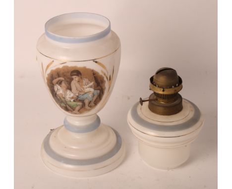A Victorian white glass oil lamp on pedestal base decorated panel of two boys (lacks chimney and shade)