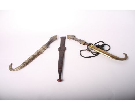 A pair of Kindjal daggers with brass scabbards, 17" long, and another dagger with decorated leather grip and scabbard