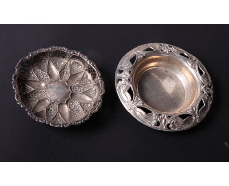A sterling silver coaster with pierced and embossed Art Nouveau decoration and a silver nut dish with pierced decoration, 4oz