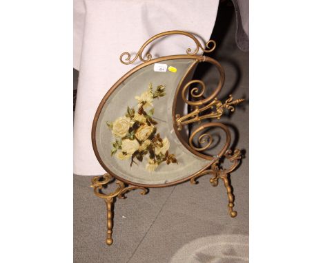 A brass framed firescreen inset crescent-shaped mirror panel painted flowers
