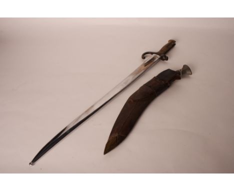 A 19th Century French bayonet with recurved 'T'-section blade, brass hilt and chrome plated scabbard and a kukri in leather s