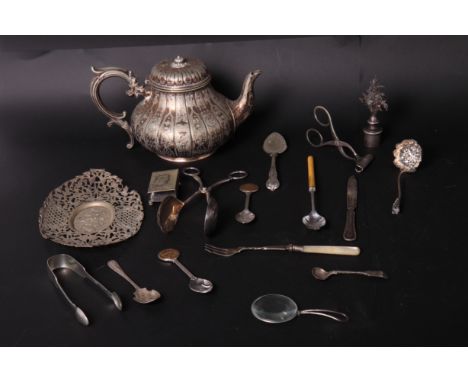 A silver plated teapot with engraved decoration, a white metal sifter spoon, a continental pierced dish and other items of pl