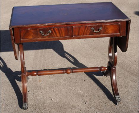 A mahogany and banded sofa table of Georgian design, on lyre end supports, 36" wide