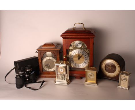 A brass faced mantel clock in mahogany case, a smaller similar walnut cased mantel clock and three other clocks