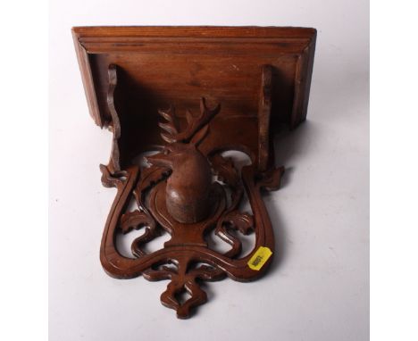 A 19th Century continental carved hardwood wall bracket with deer decoration, 9" wide