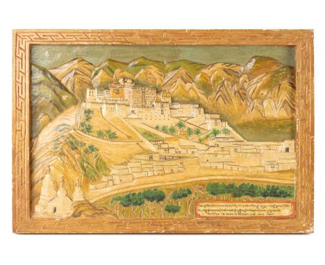 A relief carved wood panel of the Potala Palace, Lhasa, Tibet, inscribed as being carved during the first lunar month (zla ba