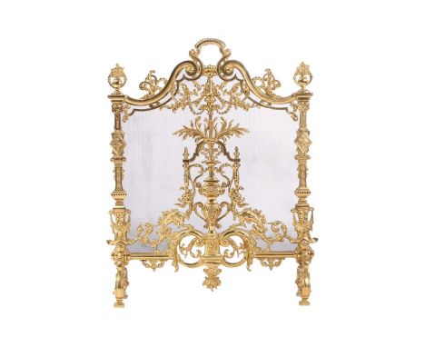 A Louis XVI-style heavy ormolu spark guard, late 20th century, with a shaped arch top above a pieced panel of Neo-Classical d