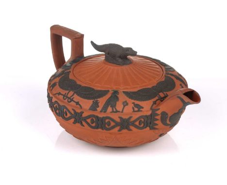 A large Wedgwood rosso antico teapot and cover, early 19th century, with applied Egyptian decoration, the cover with crocodil