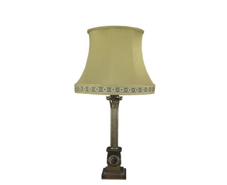 A BRASS CORINTHIAN COLUMN LAMP, on plinth base, 52cm high. Sold by order of the Executors of Eileen, Countess of Mount Charle