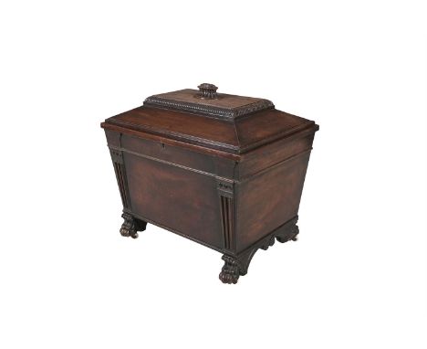 A GEORGE IV IRISH MAHOGANY CELLARETTE, BY MORGAN OF DUBLIN, the sarcophagus shape with flat domed hinged lid above fluted pil