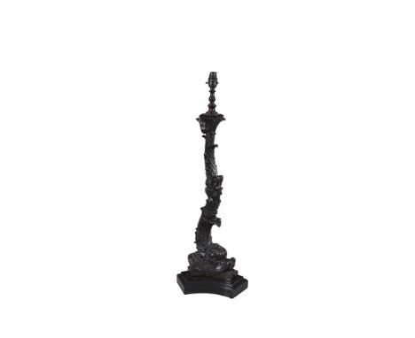 A RENAISSANCE STYLE BRONZED TABLE LAMP, in the form of a naturalistic cast leaf column with stylised dolphin support, on a tr