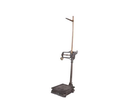 A LATE 19TH CENTURY CAST IRON FLOOR SCALES BY W&T AVERY OF BIRMINGHAM, measuring height and weight. 116cm high (not including
