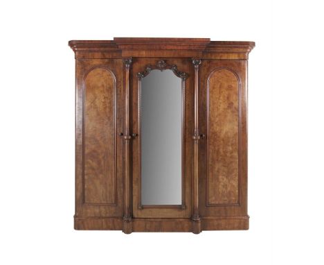 A VICTORIAN MAHOGANY BREAKFRONT WARDROBE, BY J.J. BYRNE OF DUBLIN, with bold moulded cornice above a central mirror, front do