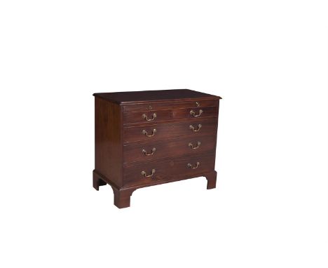 A GEORGE III MAHOGANY RECTANGULAR CHEST, of four long graduated drawers, with brushing slide and fitted brass handles, raised