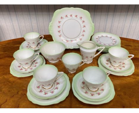 Vintage Bone China Tea Set, delicate rose pattern with green trim, comprising six tea cups, five saucers, 12 side plates, bre