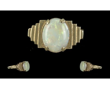 18ct Gold Attractive Single Stone Opal Set Ring. Marked 18ct to Interior of Shank. The Oval Shaped Opal of Pleasing Soft Colo