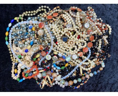 Collection of Vintage Costume Jewellery including beads, pearls, pendants, shell necklaces, etc.