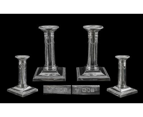 Edwardian Period 1902-1910 Fine Pair of Sterling Silver Candlesticks, supported on square stepped bases. Hallmark London 1904