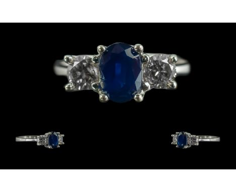 Ladies 18ct White Gold 3 Stone Sapphire and Diamond Set Ring. Full Hallmark to Interior of Shank. The Central Faceted Sapphir