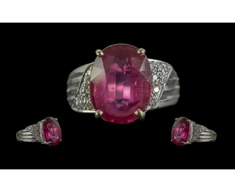 9ct White Gold - Impressive Ruby and Diamond Set Ring. Full Hallmark to Shank. The Large Faceted Stone to Centre with Diamond