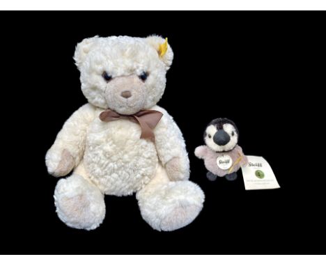 Steiff Teddy Bear, cream soft plush fur, Steiff button in ear, measures approx. 12" high.  Together with a Steiff Lari Baby P